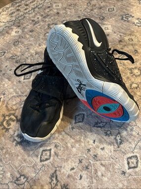 Nike Kids Black Sneakers with White Swoosh and Multicolor Sole